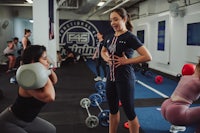 a group of women working out in a gym